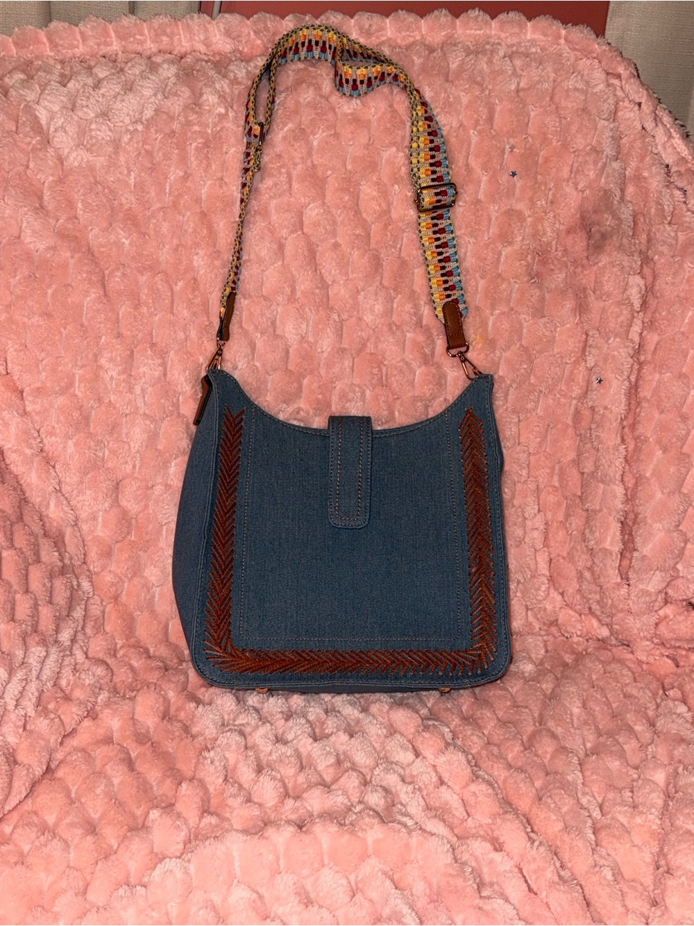 Blue Denim Crossbody Bag with Brown Trim and Colorful Strap